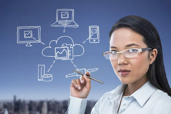 Attractive businesswoman holding pen — Stock Photo, Image