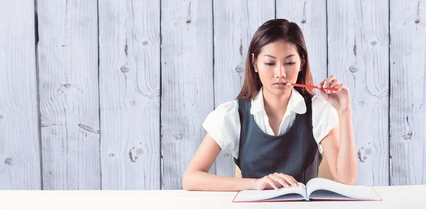 Thoughtful businesswoman reading — Stock Photo, Image