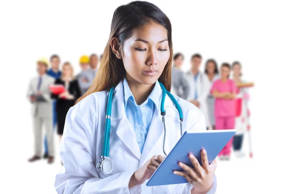 Asian doctor using tablet — Stock Photo, Image