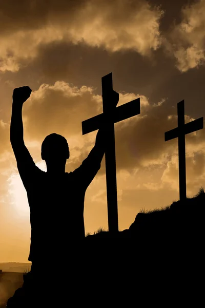 Male silhouette against cross — Stock Photo, Image