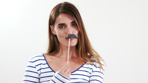 Brunette with fake mustache posing for camera — Stock Video