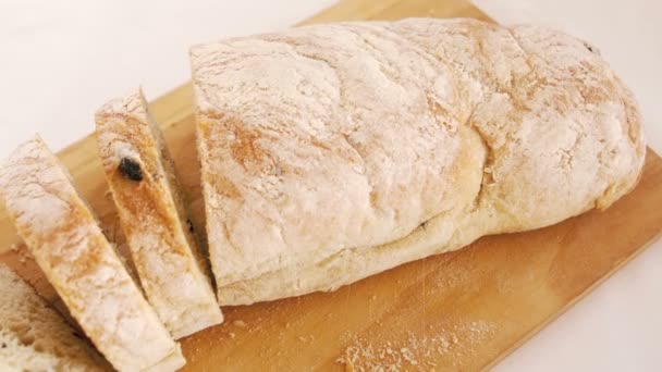 View of bread on a wood board — Stock Video