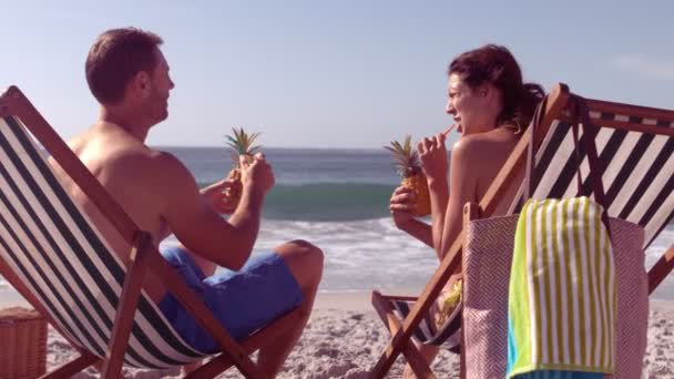 Peaceful couple drinking pinapple cocktail — Stock Video