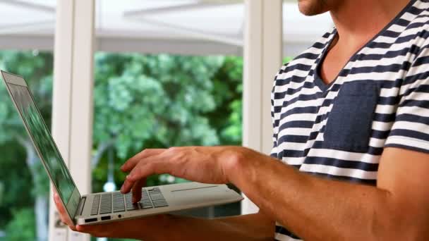 Handsome using laptop — Stock Video