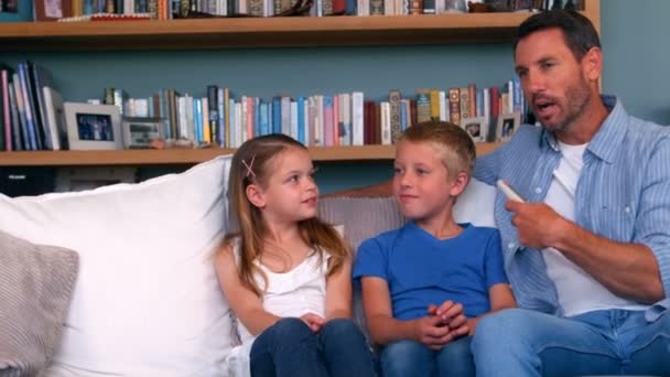 Happy family sitting together — Stock Video