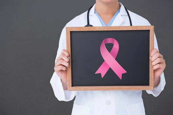 Doctor holding board with aids symbol — Stock Photo, Image