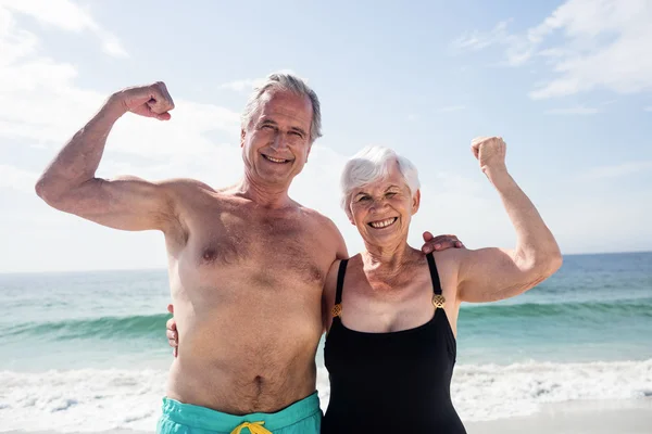 Senior couple flexing their muscle — Stock Photo, Image