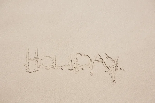 Святкові слова в піску на пляжі — стокове фото
