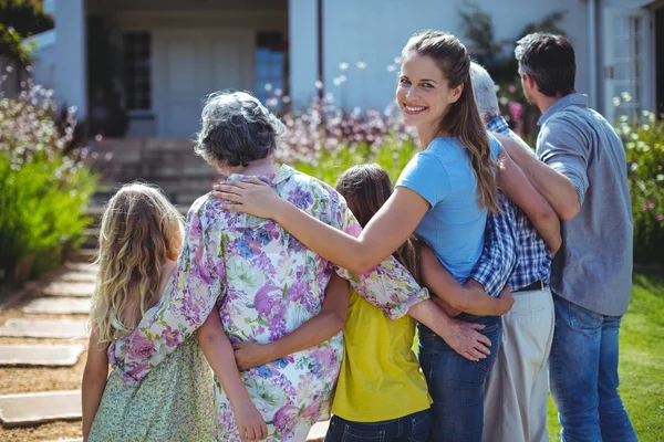 Cheerful woman with family — Stock Photo, Image