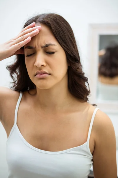 Young woman getting headache — Stock Photo, Image