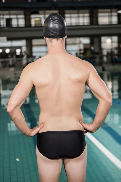 Swimmer standing by pool — Stock Photo, Image