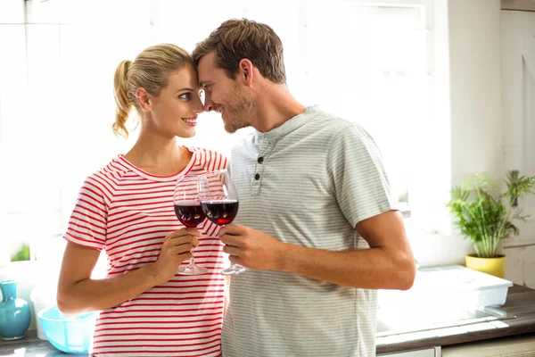 Happy couple holding wineglasses — Stock Photo, Image