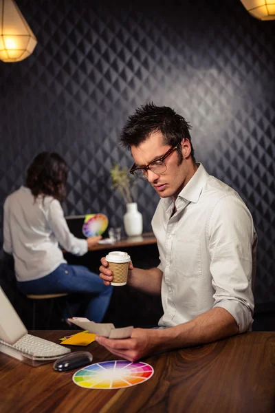 Businessman working with colour samples — Stock Photo, Image