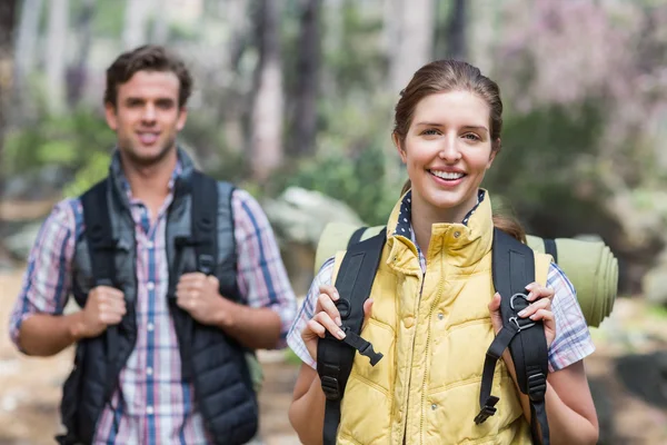 Happy couple standing in forest — Stock Photo, Image