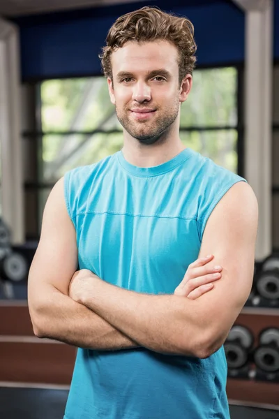 Handsome man standing in gym — Stock Photo, Image