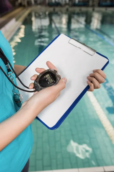 Coach with stop watch and clipboard — Stock Photo, Image