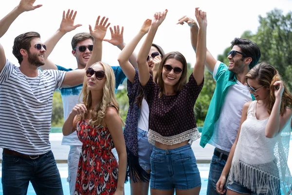 Friends dancing near the pool — Stock Photo, Image