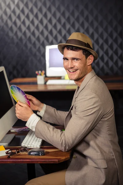 Creative businessman using colour sample — Stock Photo, Image