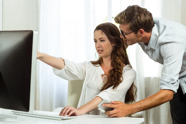 Collegues using computer at office — Stock Photo, Image