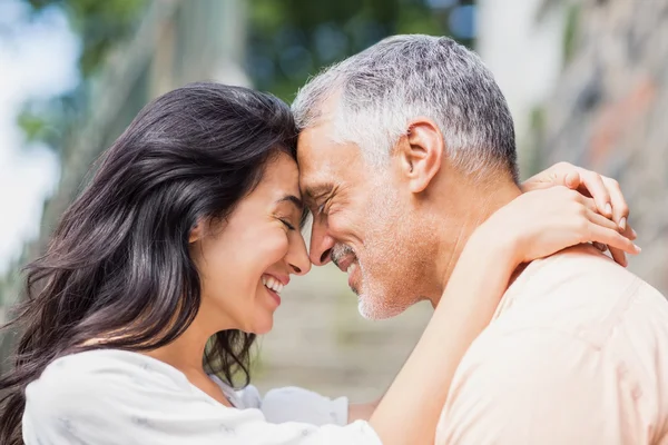 Happy couple embracing outdoors — Stock Photo, Image