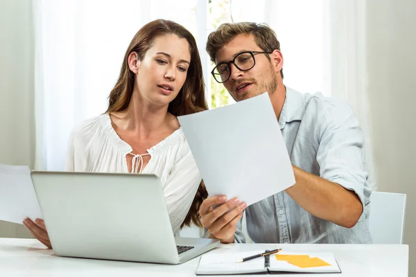Colleagues discussing document at office — Stock Photo, Image