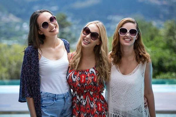 Women smiling near pool — Stock Photo, Image