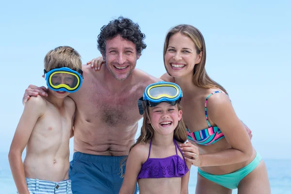 Family in swimwear at beach — Stock Photo, Image