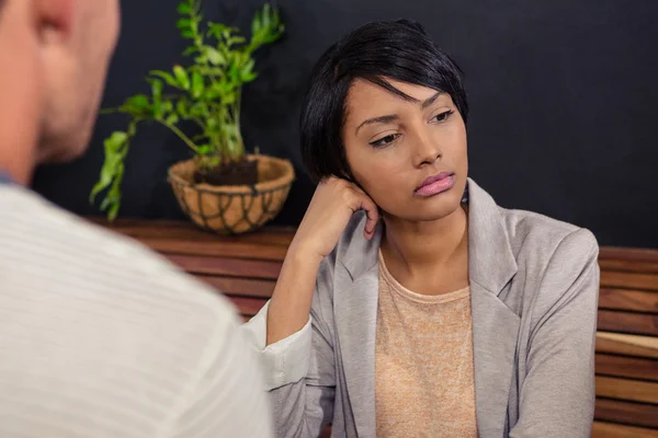 Unhappy woman in front of boyfriend — Stock Photo, Image