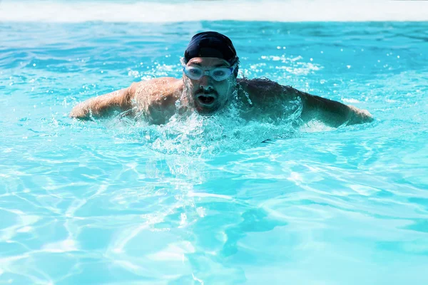 Fit swimmer doing butterfly stroke — Stock Photo, Image