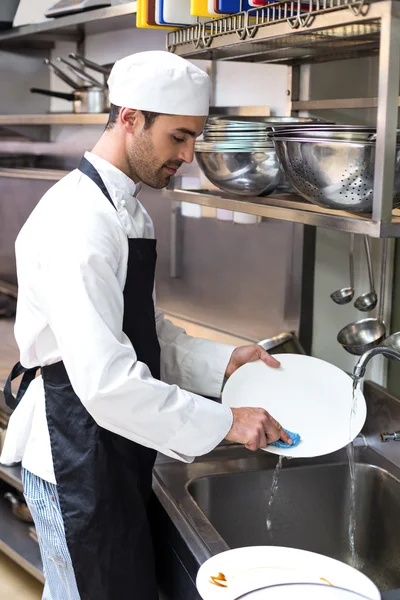 Handsome employee doing dishes — Stock Photo, Image