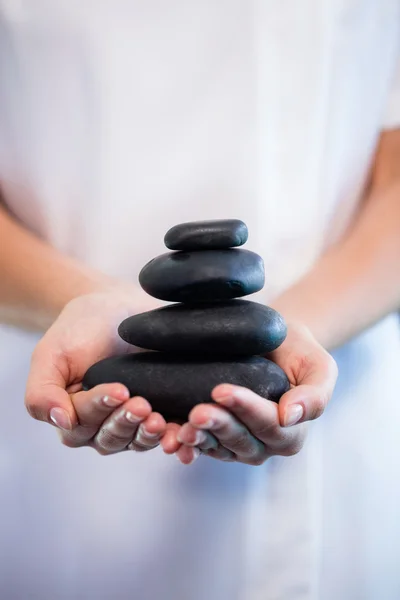 Masseuse holding stones massage — Stock Photo, Image