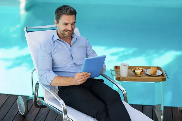 Smart man using digital tablet — Stock Photo, Image