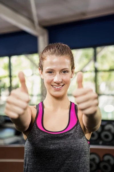 Woman showing her thumbs up — Stock Photo, Image