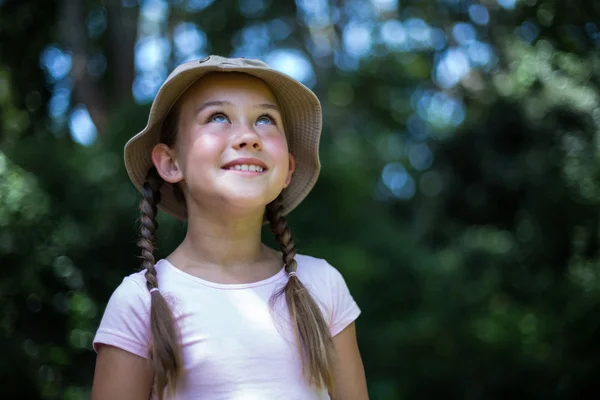 Smiling surprised girl looking up — Stock Photo, Image