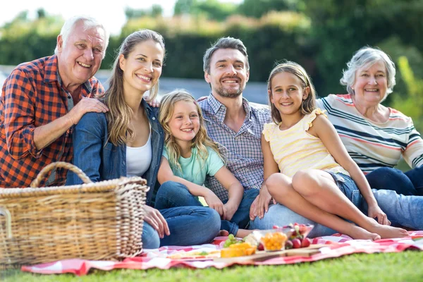 Happy multi-generation family sitting — Stock Photo, Image