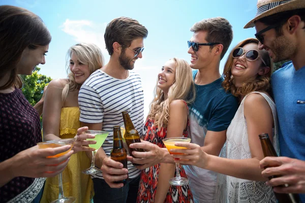 Couple enjoying with their friends — Stock Photo, Image