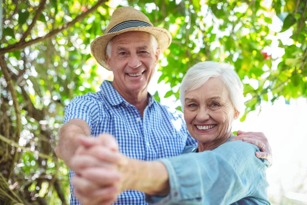 Retired couple dancing outdoors — Stock Photo, Image