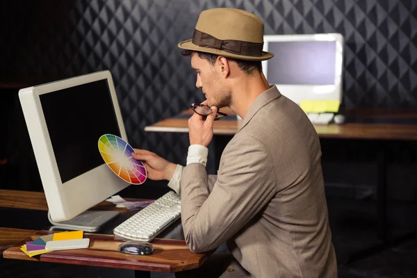 Creative businessman using colour sample — Stock Photo, Image