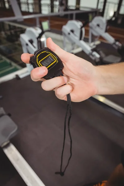 Trainer holding stopwatch — Stock Photo, Image