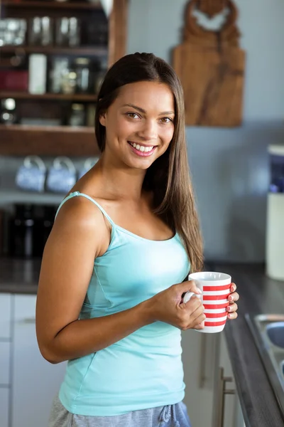 Woman holding coffee cup — Stock Photo, Image