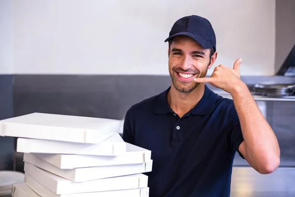 Pizza delivery man carrying boxes — Stock Photo, Image