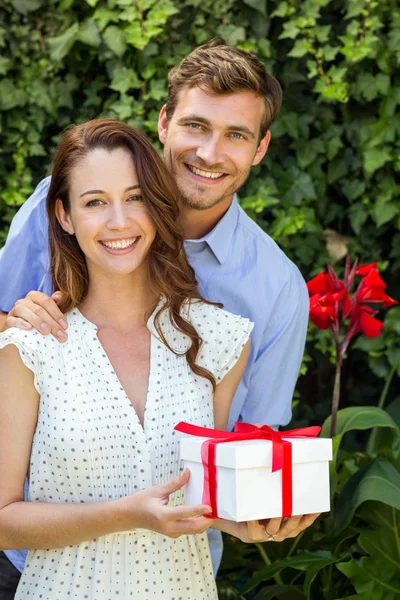 Happy man giving gift — Stock Photo, Image