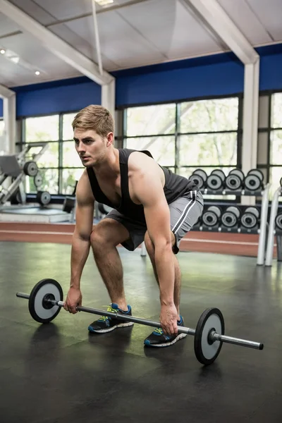 Man lifting heavy barbell — Stock Photo, Image