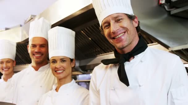 Group of chefs holding plates — Stock Video