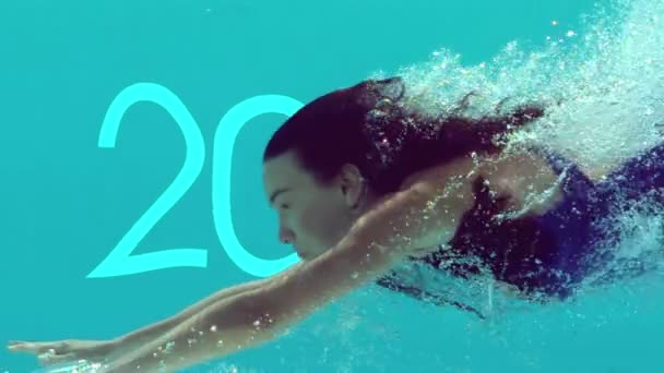 Woman swimming underwater — Stock Video