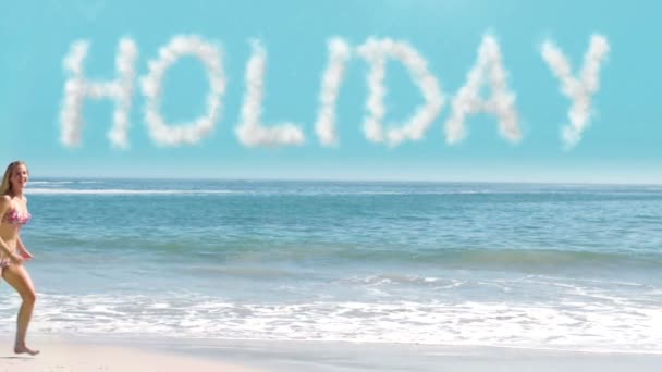 Woman jumping over the word holiday — Stock Video