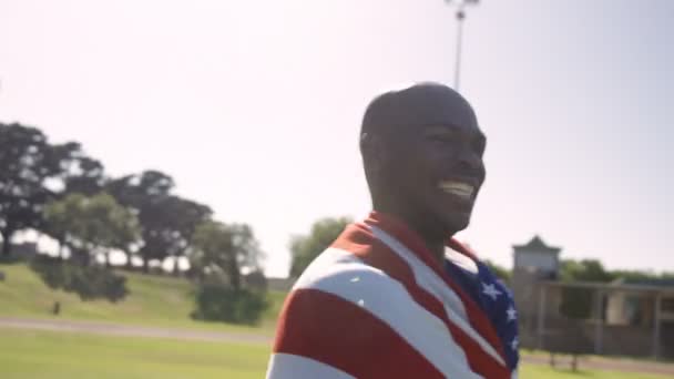 Athlete holding american flag — Stock Video