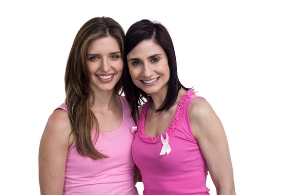 Lächelnde Frauen in rosa Outfits posieren — Stockfoto