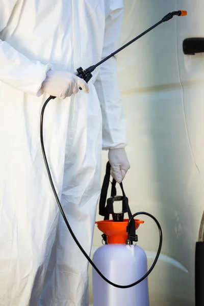 Mid section of pest control man standing next to a van — Stock Photo, Image