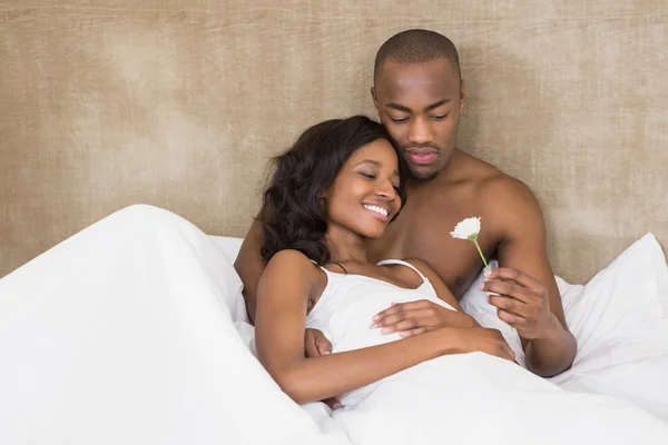 Man offering flower to woman — Stock Photo, Image